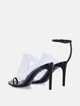 Alaïa ssymmetric leather sandals with transparent strap -  | Spazio Pritelli