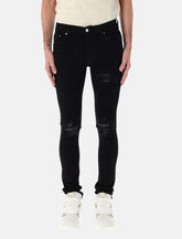 Amiri MX1 italian stretch denim jeans with leather inserts - | Spazio Pritelli