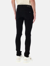 Amiri MX1 italian stretch denim jeans with leather inserts - | Spazio Pritelli