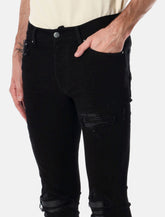 Amiri MX1 italian stretch denim jeans with leather inserts - | Spazio Pritelli