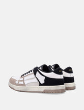 Amiri Skel Top low distressed leather sneakers - | Spazio Pritelli