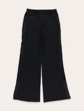 MM6 Maison Margiela Kids black jogger trousers with side bands - | Spazio Pritelli