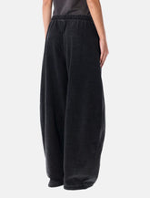 Pantaloni ampi in denim nero elasticizzato di Alexander Wang - | Spazio Pritelli