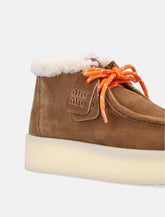 Miu Miu stivaletti in camoscio con fodera shearling -  | Spazio Pritelli