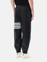 Pantaloni track neri con 4-Bar di Thom Browne - | Spazio Pritelli
