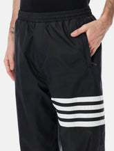 Pantaloni track neri con 4-Bar di Thom Browne - | Spazio Pritelli