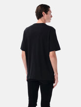 Amiri black Staggered Logo t-shirt - | Spazio Pritelli