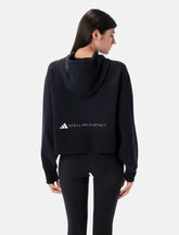 Felpa cropped con cappuccio nera di Adidas by Stella McCartney - | Spazio Pritelli
