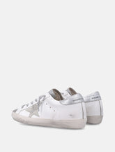 Sneakers Golden Goose Super-Star in pelle bianca e argento da donna - | Spazio Pritelli