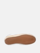 Sneakers da donna Golden Goose Super-Star in nappa bianca con stella rosa metallizzata - | Spazio Pritelli