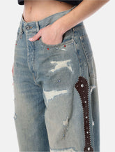 Amiri Bones wide-leg studded jeans - | Spazio Pritelli