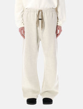 Fear of God Essentials Flare sweatpants oatmeal heather - | Spazio Pritelli