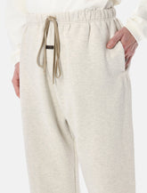 Fear of God Essentials Flare sweatpants oatmeal heather - | Spazio Pritelli