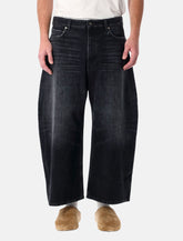 Balenciaga curved-leg denim jeans - | Spazio Pritelli