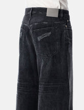 Balenciaga curved-leg denim jeans - | Spazio Pritelli