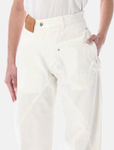 JW Anderson twisted denim jeans - | Spazio Pritelli