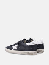 Golden Goose Super-Star black leather sneakers with white star - | Spazio Pritelli