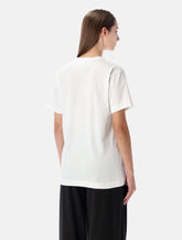 T-shirt bianca con cuore nero e borchie di Comme des Garçons Play -  | Spazio Pritelli