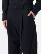 Studio Nicholson cropped wool navy Tuck trousers -  | Spazio Pritelli