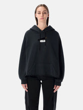 Felpa con cappuccio nera di MM6 Maison Margiela -  | Spazio Pritelli