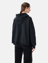 Felpa con cappuccio nera di MM6 Maison Margiela -  | Spazio Pritelli