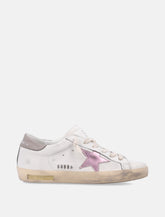 Sneakers da donna Golden Goose Super-Star in nappa bianca con stella rosa metallizzata -  | Spazio Pritelli