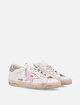 Sneakers da donna Golden Goose Super-Star in nappa bianca con stella rosa metallizzata -  | Spazio Pritelli