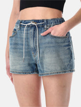 Shorts in denim con coulisse gioiello di Alexander Wang -  | Spazio Pritelli