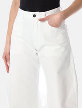 Alaïa low waist curved jeans -  | Spazio Pritelli